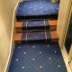 Habillage des palier en moquette collée de mur à mur et tapis d'escalier en passage